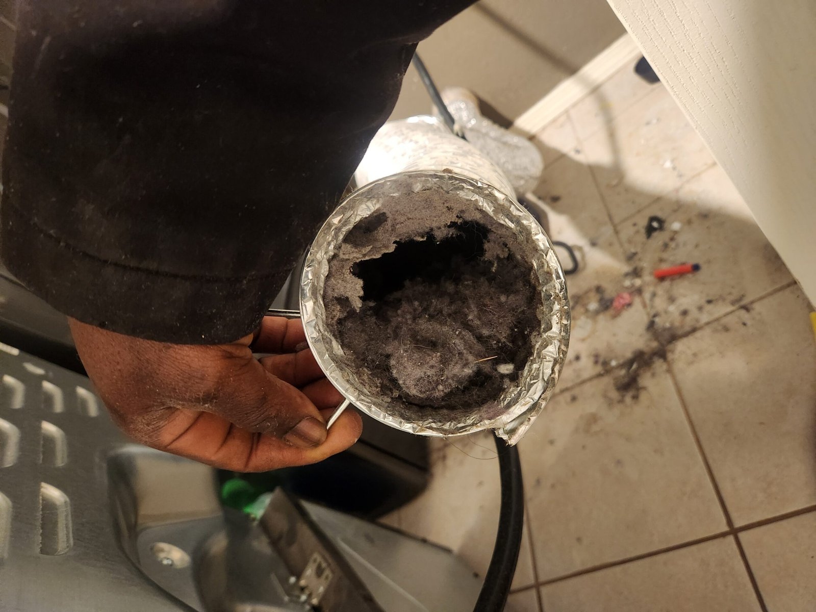 Dryer vent buildup before maintenance service