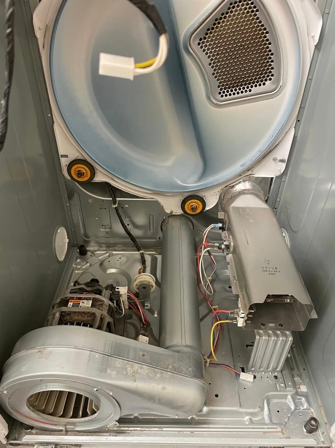 Clean residential dryer interior after preventive maintenance service